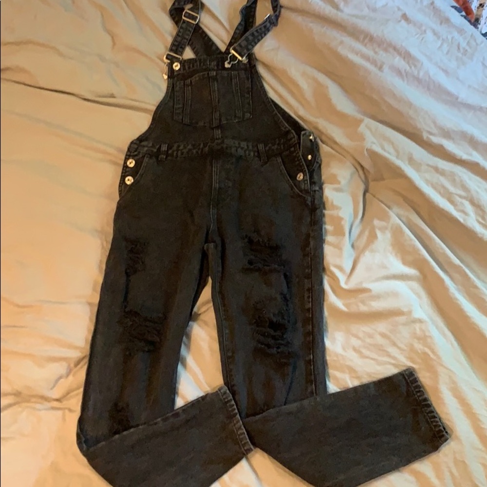 Distressed black denim overalls